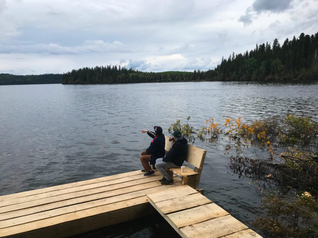 Elders Edith Orr and Dora L’Hommecourt looking out onto Moose Lake. Photo: Alex Davies Post.