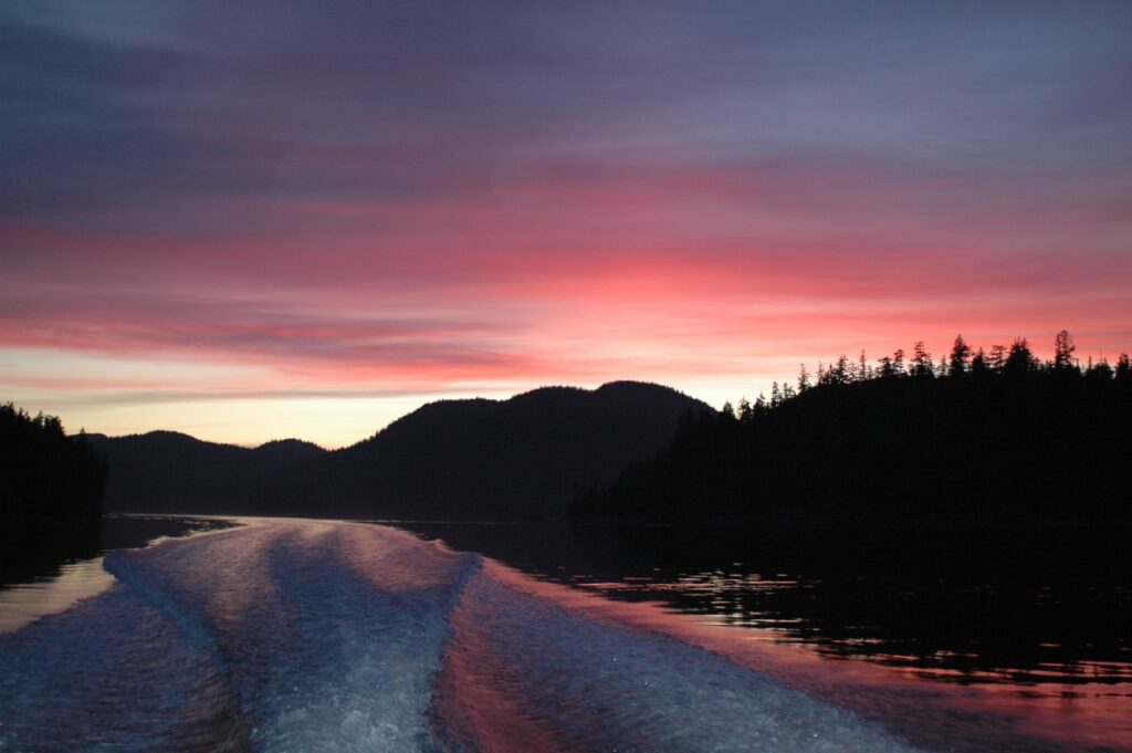 Traveling down Matilda Inlet looking northeast, sunset in Ahousaht territories. Photo: Tara Atleo