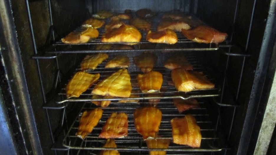 Local or native fish species from the Great Lakes being smoked in a smoker