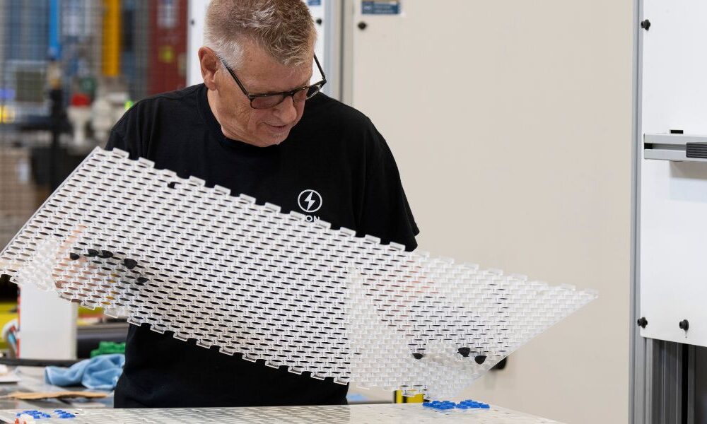 An employee works on a prototype of an electric battery at Lion Electric Company's lithium-ion battery manufacturing facility in Mirabel, Que., Thursday, Sept. 14, 2023.