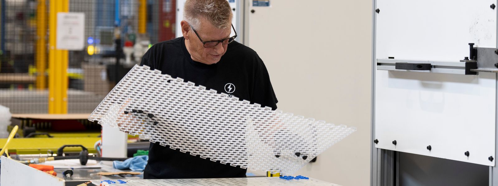 An employee works on a prototype of an electric battery at Lion Electric Company's lithium-ion battery manufacturing facility in Mirabel, Que., Thursday, Sept. 14, 2023.