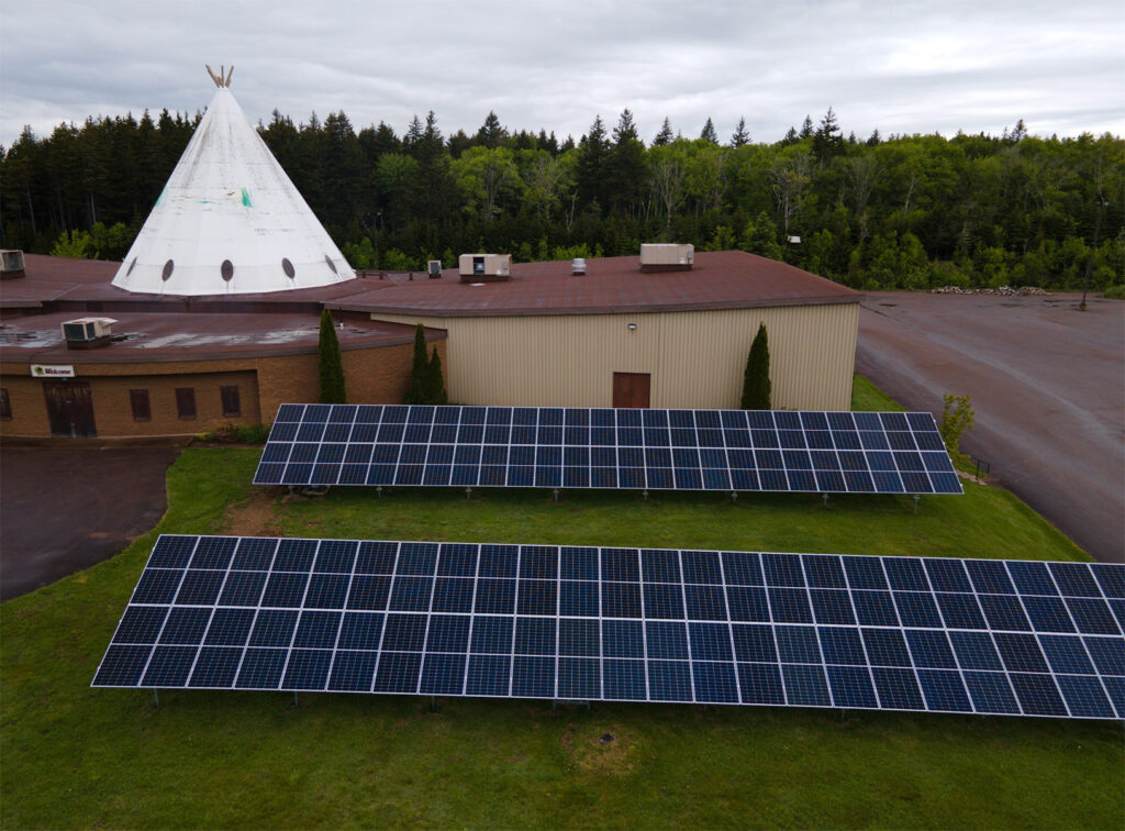 Picture of the four net-metering solar systems connected to commercial buildings in the community of Amlamgog.